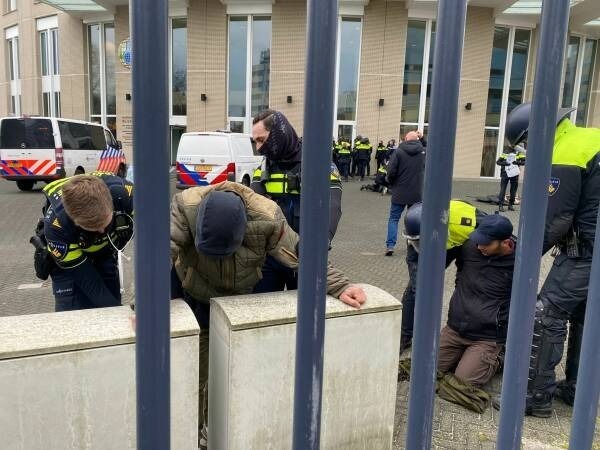 Dutch police arresting activists