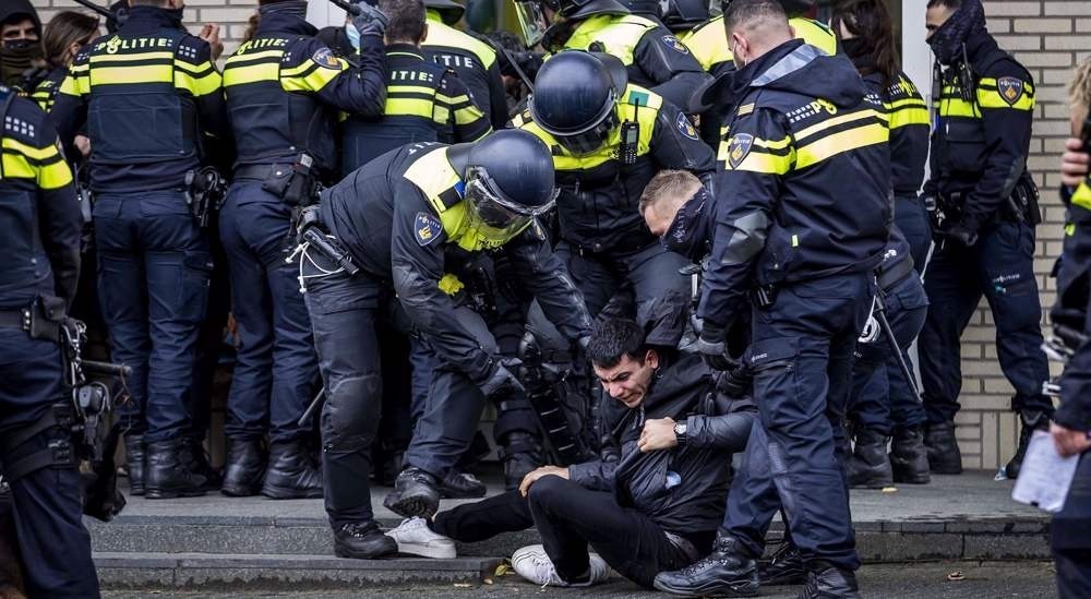 Dutch police arresting activists