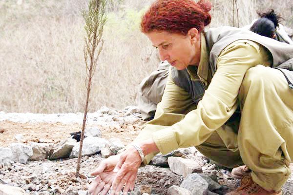 Sakine Cansiz planting a tree