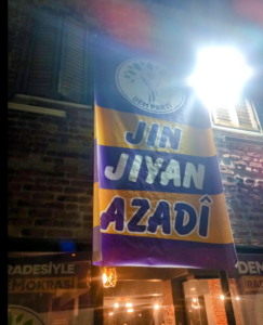 Banner reading ‘Jin, Jiyan, Azadi’
